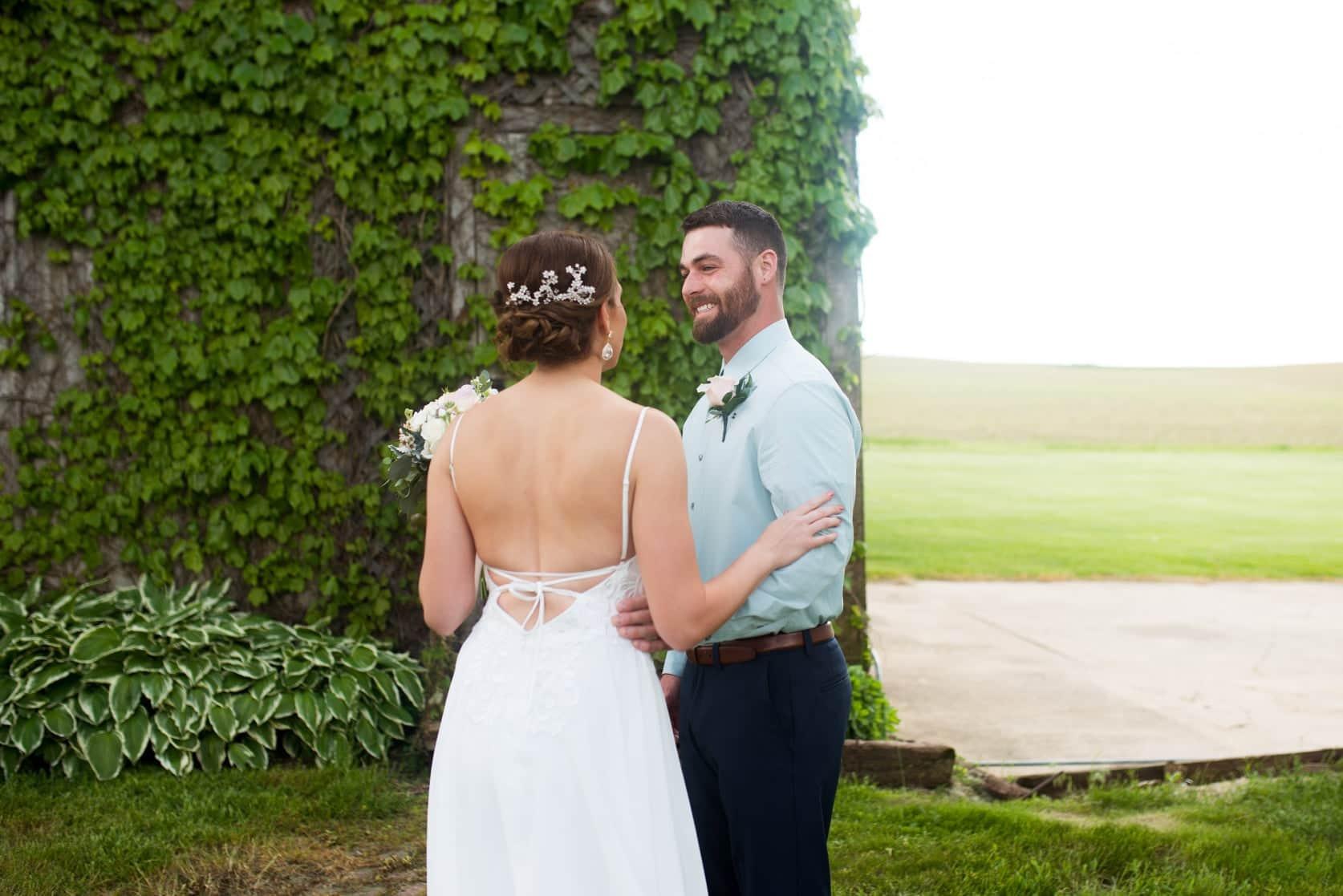 Back detail of a bridal dress in an outdoor setting